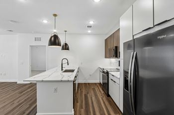 Modern kitchen with island and pendant lighting